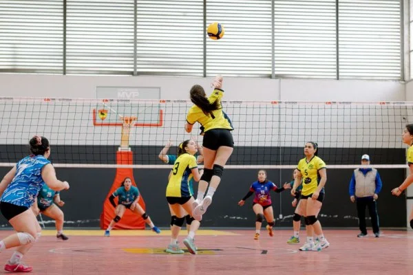 indoor volleyball match action